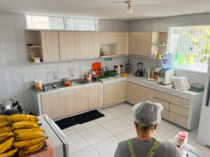 A kitchen at the FAD community center with a cook in a hairnet
