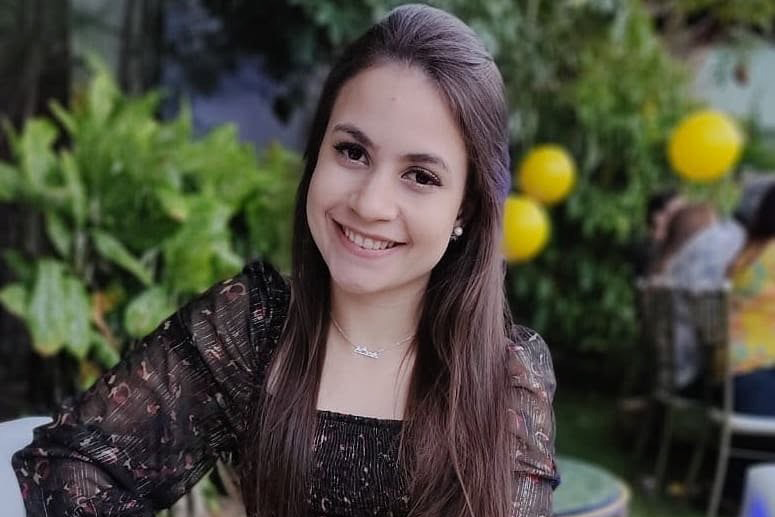 A young girl named anita sitting down