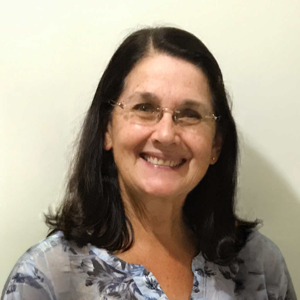 Woman with glasses smiling